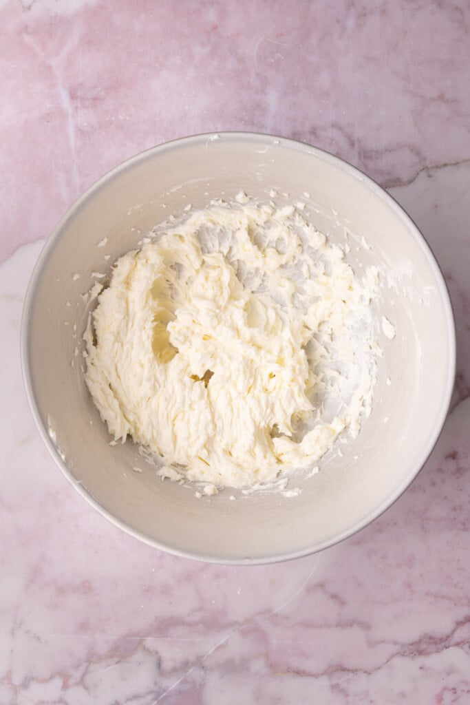 Cream cheese and butter whipped together in a large mixing bowl.