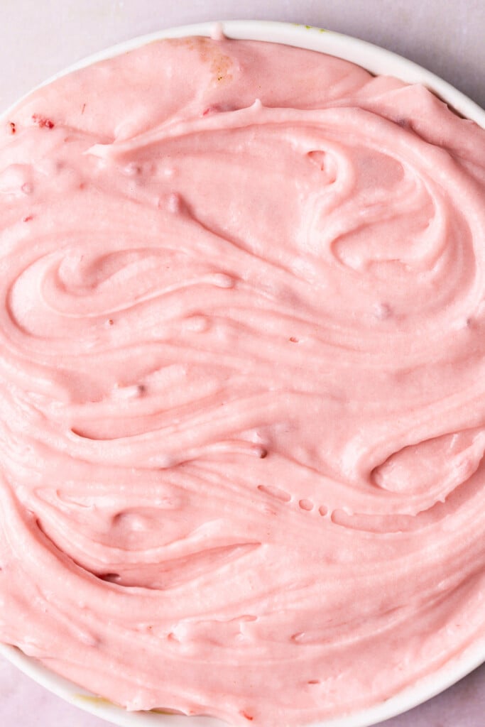 Cream cheese frosting that is naturally pink from a fresh strawberry reduction.