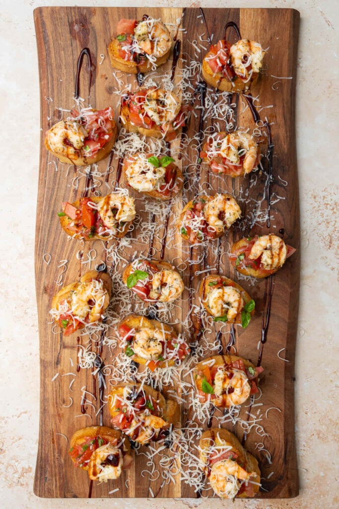 Toasted baguette topped with bruschetta and baked shrimp, drizzled with balsamic glaze, and finished with freshly grated Parmesan.