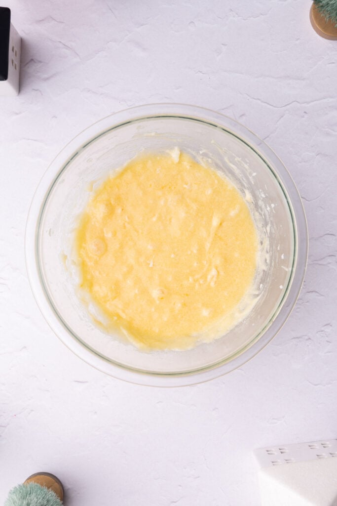 Butter, sugar, egg, and vanilla extract mixed together in large bowl.