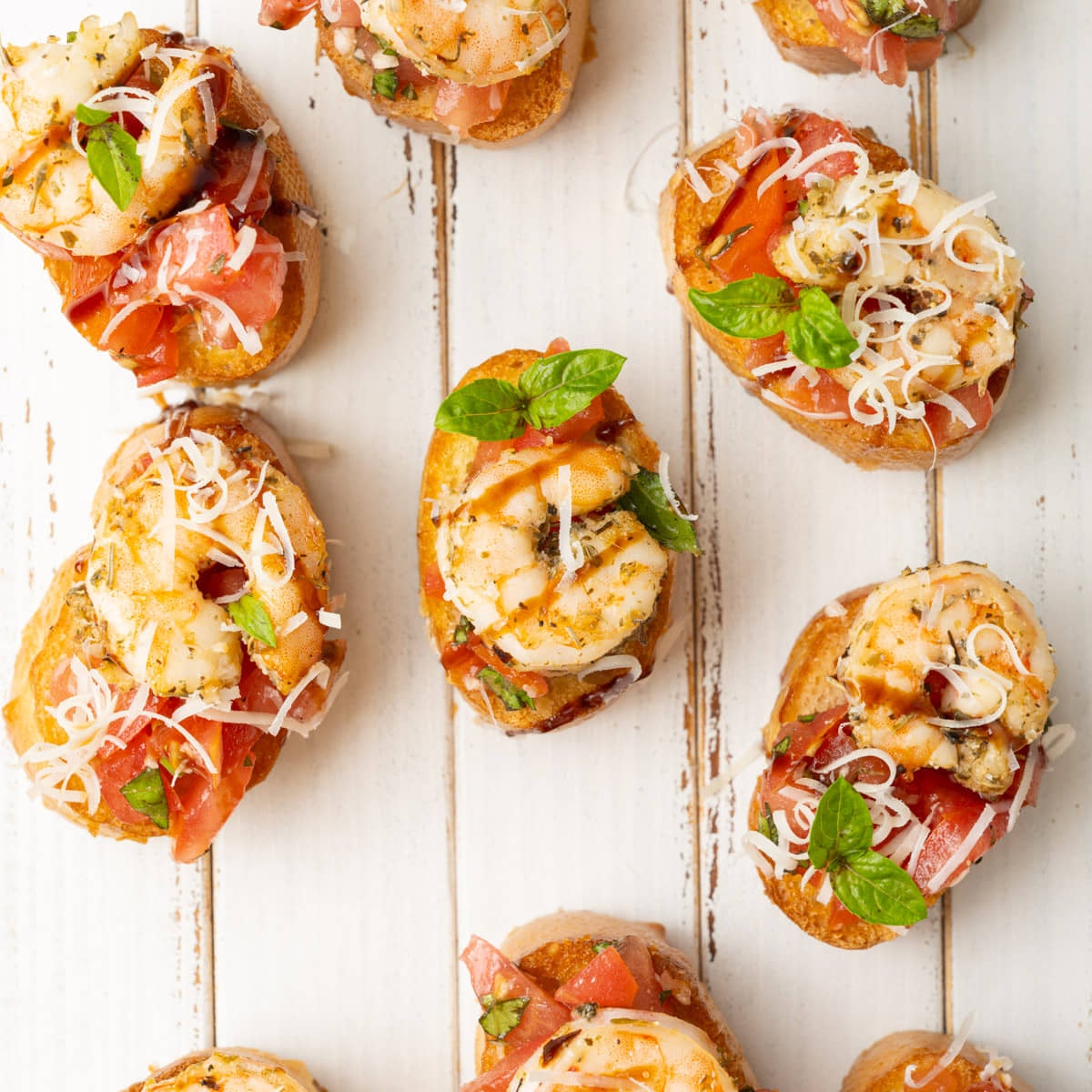 Bruschetta with baked shrimp on top.
