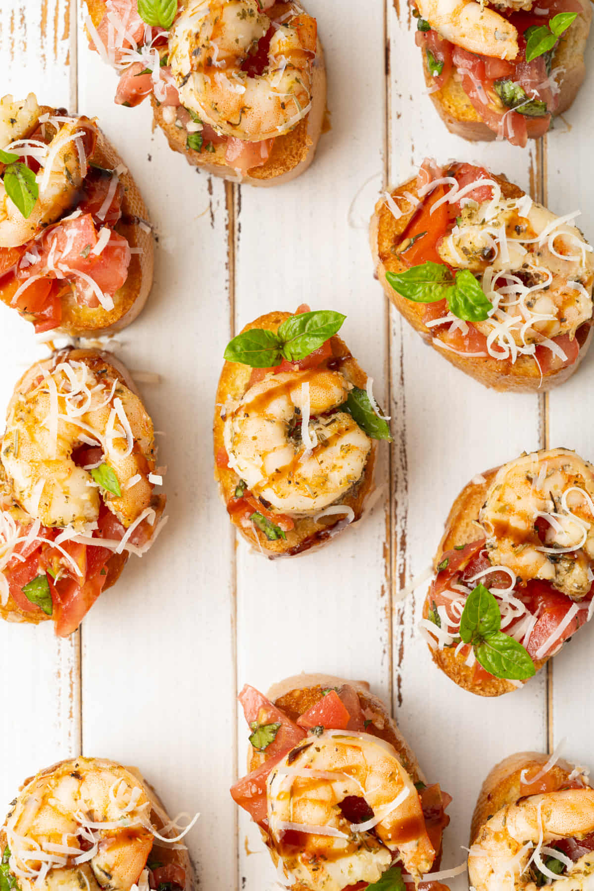 Overhead image of shrimp bruschetta- the perfect handheld pescatarian appetizer.