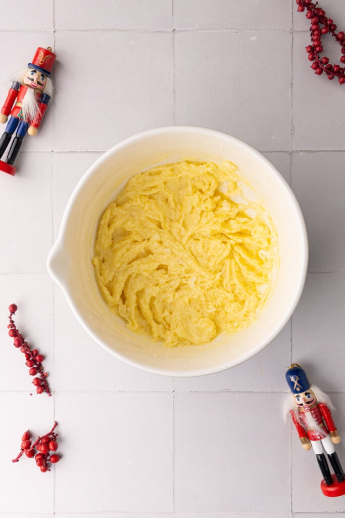 Egg and vanilla extract mixed in to creamed butter and sugar.