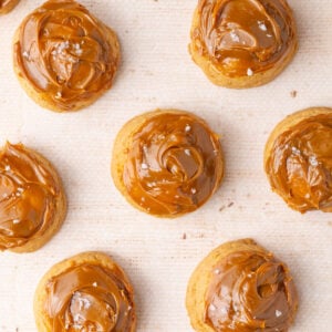 Overhead image of cookies made with dulce de leche both in the dough and spread on top.