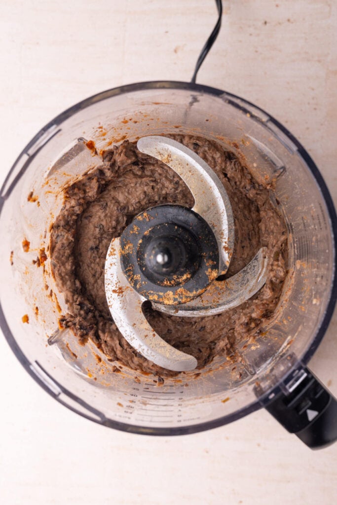 Black beans, taco seasoning, and salsa blended up in a food processor.