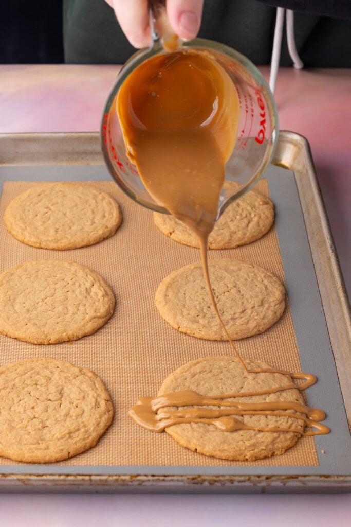 Topping cookies with melty cookie butter drizzle for a fun design and punch of extra Biscoff flavor.