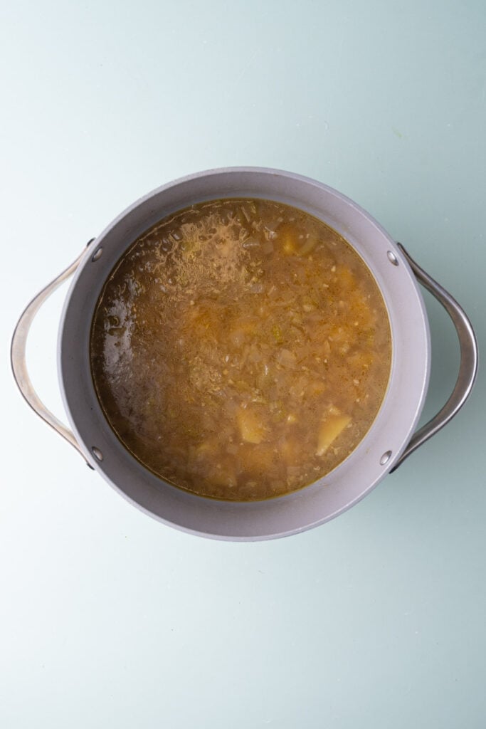 Simmering soup with vegetable broth until the chunks of potatoes are fork tender.