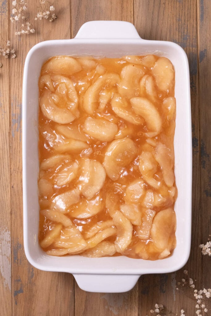 Apple pie filling in a casserole dish.
