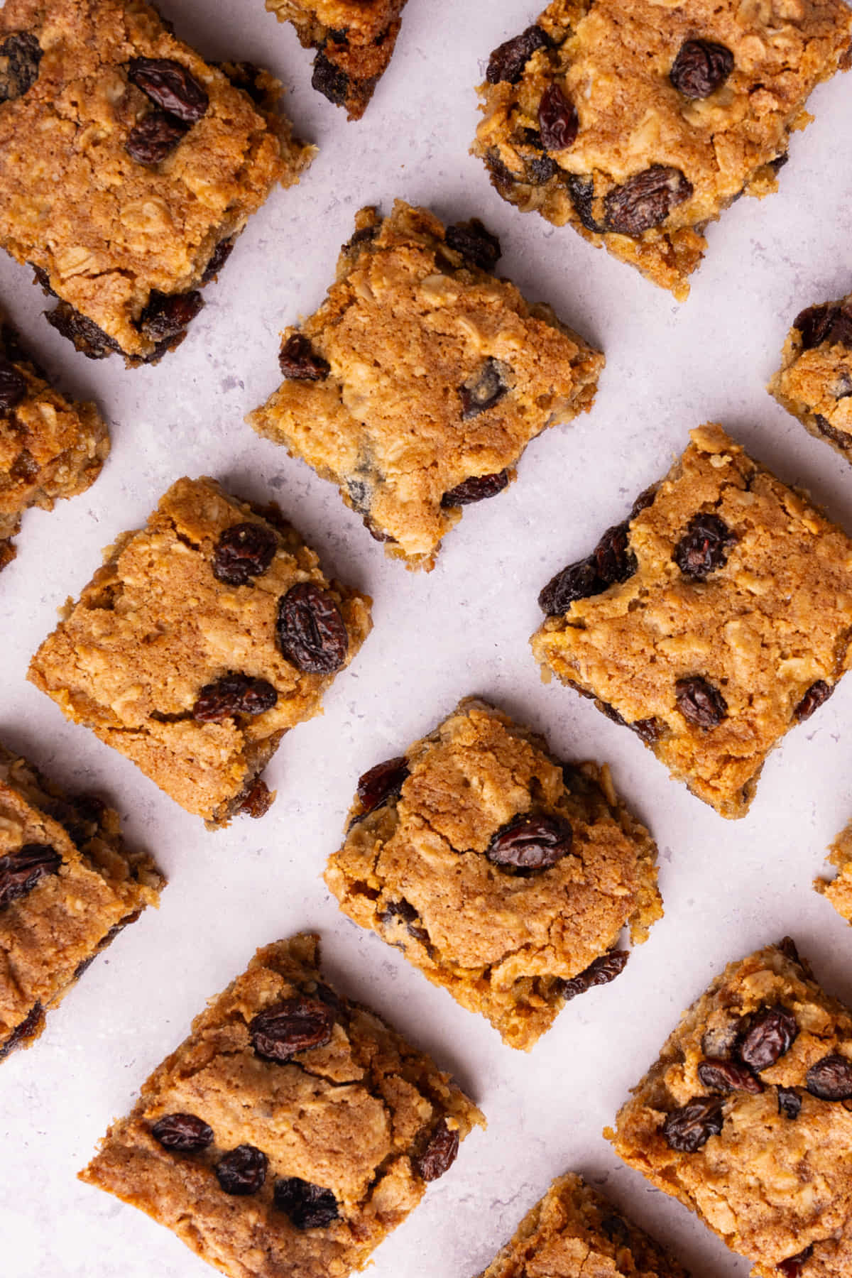 Overhead image of chewy oatmeal cookie bars with raisins.