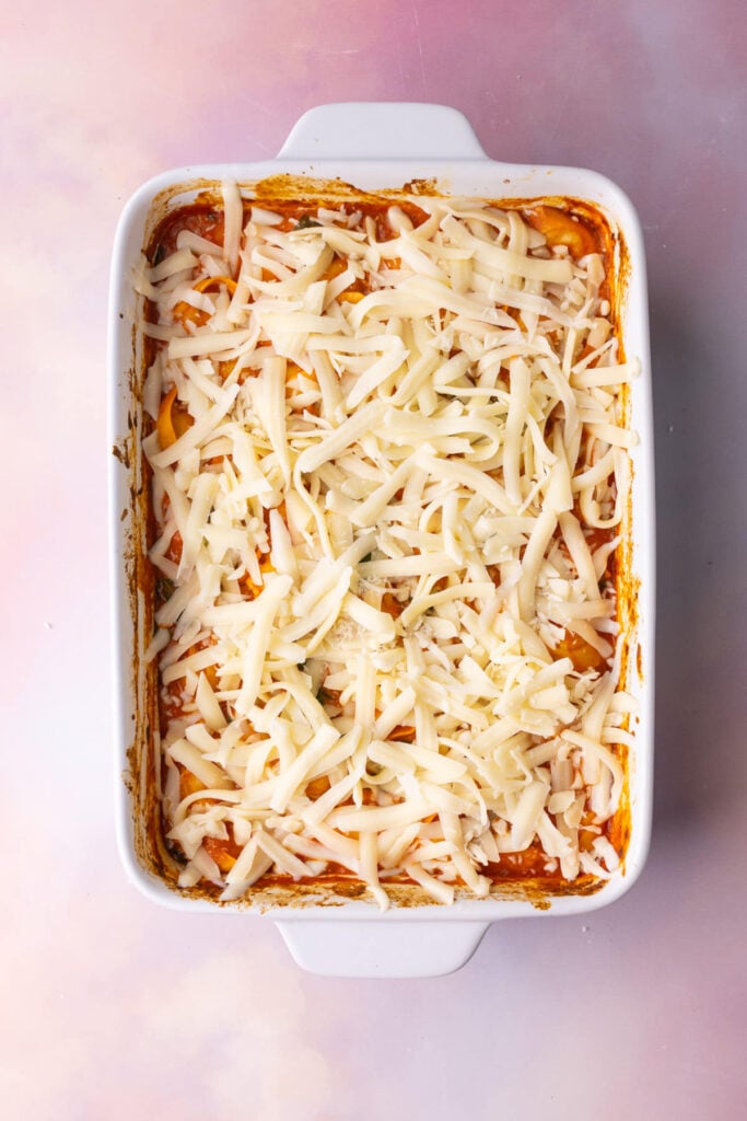 Mozzarella cheese layered on top of tortellini bake.