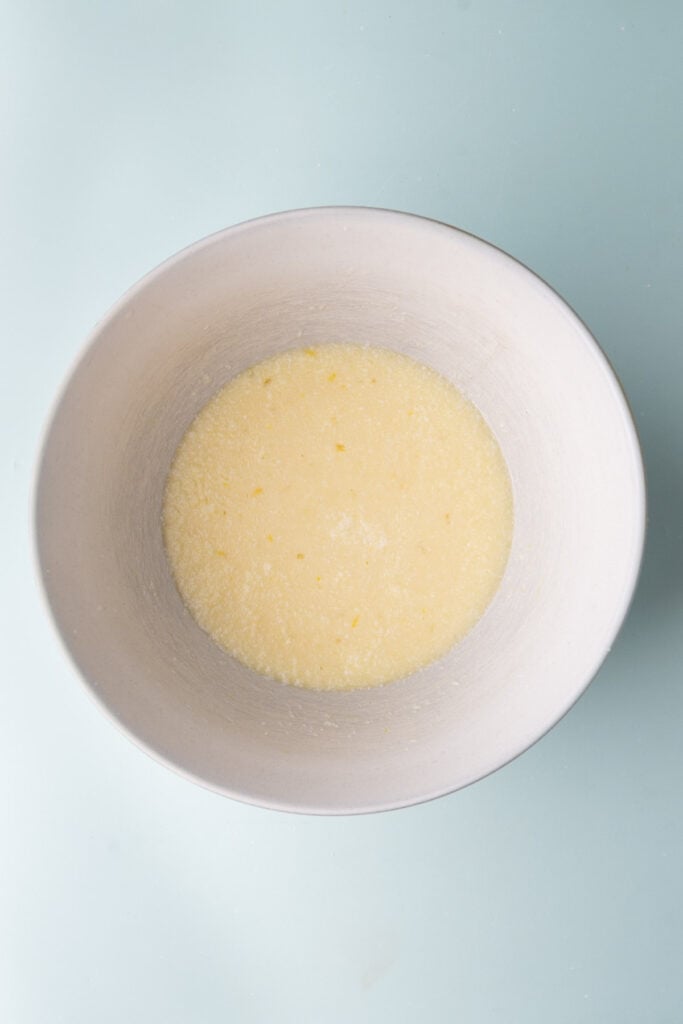 Melted butter, milk, eggs, sugar, salt, and vanilla extract whisked together to make a custard for bread pudding.