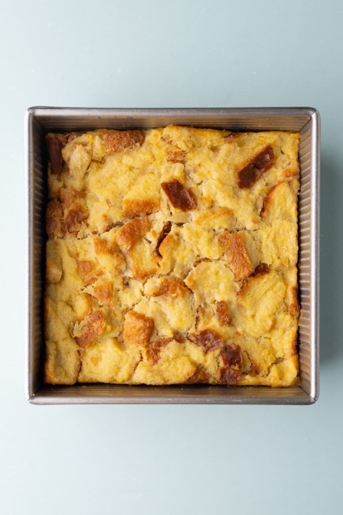 Pineapple bread pudding fresh out of the oven still cooling in the pan.