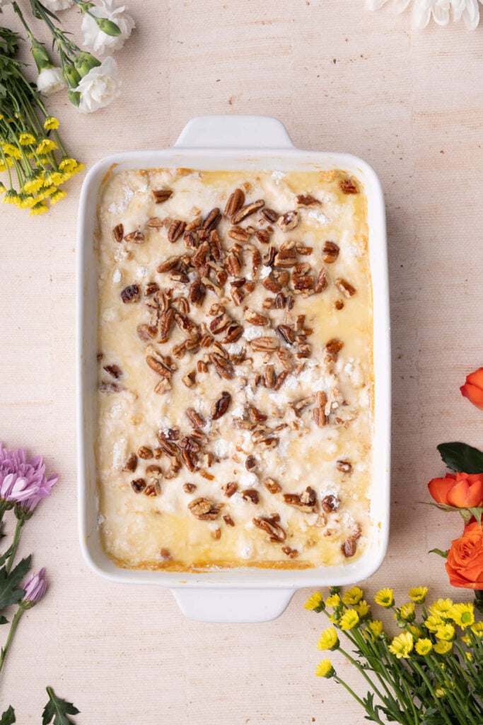 Pumpkin dump cake made with condensed milk and yellow cake mix ready to bake in the oven.