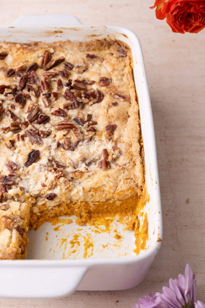 Angled shot of pumpkin dump cake to show the distinct layers in the pan.