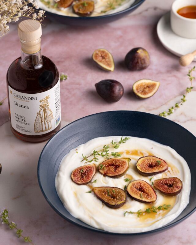 These delicious roasted figs are succulent and sweet, bursting with flavor from @carandinius Bianca Sweet White Vinegar, served atop creamy honey Greek yogurt. Carandini is one of the oldest family-owned vinegar producers, utilizing techniques passed down from generation to generation, and combining centuries of expertise with cutting-edge technology to bring you the absolute highest quality vinegar from Modena, Italy. Head to the “Where to Find Us” tab on their website to find their artisanal products near you. Check out the full recipe below. #ModeneseTaleofTaste #Carandini #CarandiniUS #CarandiniModena

Roasted Sweet White Vinegar Figs (serves 2):
-8 ounce fresh black mission figs 
-2 tablespoons @carandinius Bianca Sweet White Vinegar
-1 tablespoon light brown sugar
-1 1/2 cups plain Greek Yogurt
-2 tablespoons honey
-fresh thyme for garnish (optional)

Method:
-Preheat the oven to 425 °F.
-Slice the figs in half lengthwise and place them on a small baking sheet.
-Drizzle @carandinius Bianca Sweet White Vinegar over figs and sprinkle on brown sugar.
-Roast for 5 minutes until vinegar and brown sugar caramelize on figs, then remove from the oven and let sit for 10 minutes to cool.
-Meanwhile, fill two bowls with 3/4 cup Greek yogurt and swirl in 1 tablespoon of honey into each bowl. 
-Serve the roasted figs on top of the yogurt and garnish with fresh thyme (optional).