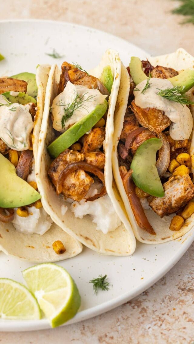 These 30 Minute Salmon Tacos with Greek Yogurt Sauce are fresh, slightly spicy, and have a subtle sweetness from the coconut rice.

Ingredients
Coconut Rice 🌮 1 cup Basmati Rice
🌮 13.66 ounces (1 can) coconut milk
🌮 1 teaspoon coconut oil (optional)
Salmon Tacos
🌮 ½ large red onion,sliced 
🌮 1 cup corn kernels (canned, frozen, or freshly cut off the cob)
🌮 2 tablespoon olive oil
🌮 3 tablespoons taco seasoning
🌮 15 ounces salmon
🌮 8 small flour tortillas
🌮 1 large ripe avocado
Greek Yogurt Sauce for Tacos
🌮 2 tablespoons lime juice (1 lime)
🌮 5.3 ounces (1/2 cup) Greek Yogurt
🌮 2 tablespoons mayonnaise (optional to thicken sauce)
🌮 ½ teaspoon cumin
🌮 ¼ teaspoon cayenne pepper
🌮 3 tablespoons fresh dill, chopped

Method

Coconut Rice
🌮in a small pot, bring rice, coconut milk, and coconut oil (optional) to a boil cover, and turn the heat all the way down to low. Simmer on low for about 20 minutes.

Salmon and Veggies
🌮Preheat your oven to 400°F.  🌮Add the onion and corn to a large baking sheet with 1 tablespoon of olive oil and roughly half of the taco seasoning and toss to coat. Roast for ten minutes. 🌮Pat salmon dry and slice into bite-sized cubes. 🌮Add the salmon cubes to a mixing bowl with the remaining 1 tablespoon of olive oil and the rest of the taco seasoning and toss.
🌮Add salmon to the baking sheet with the corn and onion and roast for an additional 8 minutes or until (internal temp of salmon should be 125°F.) 
Greek Yogurt Sauce for Tacos
🌮 Squeeze lime juice into small mixing bowl. 🌮Add the Greek yogurt, mayonnaise (optional), cumin, cayenne pepper, and chopped dill to the bowl and whisk to combine. 
Assembling Your Tacos
🌮Add a thin layer of coconut rice to tortillas. 🌮Top with a generous amount of corn, red onion, and salmon. 🌮Finish with sliced avocado and Greek yogurt sauce.
#salmontacos #fishtacos #greekyogurt #easydinner #pescatarian #tacotuesday