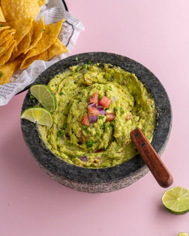 This recipe for Tableside Guacamole at home gives you restaurant-quality guac in your own kitchen with just a few fresh ingredients and spices. What are you guys making this weekend?? 

Tableside Guacamole
🥑½ large tomato (globe, beefsteak, or slicing tomato)
🥑 ¼ large red onion
🥑 2 large ripe haas avocados
🥑 1 tablespoon lime juice (½ lime)
🥑 ¼ teaspoon cumin
🥑 ¼ teaspoon salt
🥑 ¼ teaspoon black pepper
🥑⅛ teaspoon cayenne pepper (or more depending on desired spice level)
Optional Flavor-Boosting Add-ins
🥑½ ounce fresh cilantro (stems and leaves, chopped)
🥑2 whole jalapeno peppers (seeded and diced)
🥑1 clove garlic (minced)
🥑¼ cup fresh mango or pineapple (diced)

Method
 🥑Start by dicing your tomato and red onion. If you're using any optional add-ins, prep them now, too.  🥑Add the diced onion, tomato, and salt (and any optional add-ins if using) to a mortar and use a pestle to mash, extracting the liquid and crushing into small, fine pieces.  🥑Add the avocado flesh to the mortar and use the pestle again to smash and integrate into the salted and crushed tomato and onion.  🥑Add the lime juice, black pepper, cumin, and cayenne pepper. Use a fork to stir until creamy and smooth. Serve immediately with tortilla chips.
#guacamole #guac #homemadeguac #guacamolerecipe
