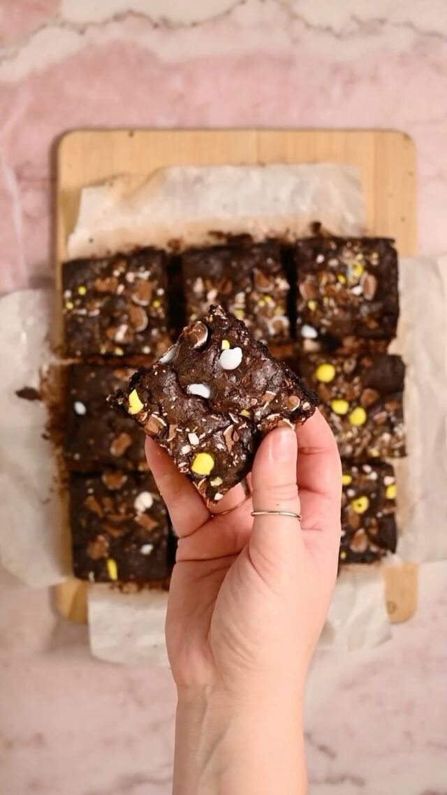 Welp I saw mini eggs on the shelf at the store today so I’m wasting ZERO time before sharing my FAVORITE seasonal treat. These Cadbury Mini Egg Brownies last about 5 minutes before being devoured every year in my house! The fun, crunchy, candy-coated chocolates add a welcomed texture (and color!) to the fudgy brownies.

Ingredients 🐰½ cup (1 stick) unsalted butter, softened
🐰 1 ¼ cup granulated sugar
🐰 2 tablespoons oil (coconut, canola, vegetable, or grapeseed)
🐰2 large eggs
🐰 2 teaspoons vanilla extract
🐰 ½ cup all-purpose flour
🐰 ¼ teaspoon salt
🐰 ½ cup unsweetened cocoa powder
🐰 2 cups Cadbury Mini Eggs
Method
🐰 Preheat your oven to 350°F and line or spray a 9 x 9-inch square pan with parchment paper.
🐰 Use a very sharp knife to chop or add 2 cups of Cadbury Mini Eggs to a storage bag and use a rolling pin to crush.
🐰 In a large mixing bowl, cream together the butter, oil, and sugar with a hand mixer on high until the mixture is smooth. 🐰 Add eggs and vanilla extract and mix again until combined.
🐰 Next, add your flour, cocoa powder, and salt and mix again until well-combined, making sure your batter is smooth and free of clumps.
🐰 Fold in roughly half of your crushed eggs, reserving the rest. Use a spatula to help with transferring your batter to your prepped pan.
🐰 Add the remaining Cadbury Mini Eggs on top of the brownie batter. Bake for 30-35 minutes. Allow the brownies to cool before slicing. Enjoy!

#cadbury #minieggs #cadburyminieggs #minieggbrownies #bestbrownies #brownierecipe #bakingfromscratch #easterbaking #springbaking #springdessert