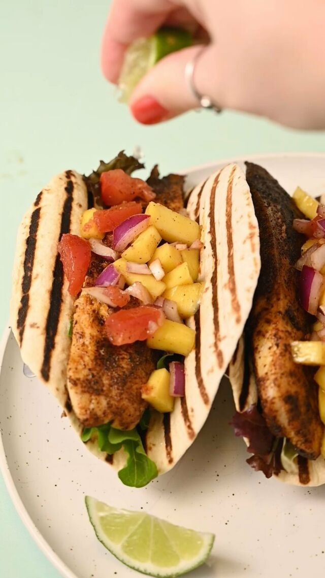 These fresh Fish Tacos with Mango Salsa are perfectly balanced between spicy, savory, and sweet. Only 9 ingredients and 30 minutes required!

-1 large mango
-1 medium tomato
-¼ large red onion
-2 tablespoons lime juice (juice of 1 lime)
-3 tablespoons taco seasoning
-1 pound tilapia or catfish (or 3 large filets)
-2 tablespoons coconut oil (or other oil of choice)
-6 small flour tortillas (or corn tortillas)
-¼ cup greens of choice (like lettuce, arugula, spring mix, etc.)
Method
-Dice your mango, tomato, and red onion and add it to a mixing bowl with the lime juice and about ½ teaspoon of taco seasoning. Stir and set aside.  -Slice all three fish filets in half longways so you are left with six pieces of fish. Use a paper towel to pat dry your fish to reduce excess moisture (try these bamboo paper towels for a more sustainable option!).
-Add the remaining taco seasoning to a shallow bowl and press the fish filets into the seasoning, so they are fully coated on both sides.  -Get the oil hot in a frying pan over medium heat for about 5 minutes before placing the seasoned fish in the hot oil. Fry no more than 3 pieces at a time, for 4-5 minutes on each side, until the internal temperature reaches 145°F. -Assemble the tacos by adding the mixed greens to the tortilla, then the cooked fish, and finally the mango salsa. Enjoy hot!
