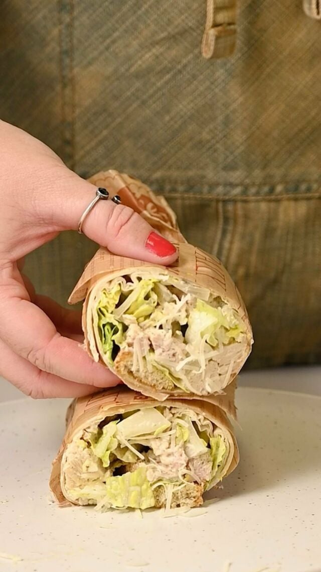 This Tuna Caesar Wrap is my go-to lunch when I want something fresh, flavorful, and filling without the fuss. Just 6 ingredients!

Tuna Caesar Wrap
-2 cups chopped Romaine lettuce
-4 ounces canned tuna in water
-⅓ cup Caesar dressing
-⅓ cup grated, shredded, or shaved Parmesan cheese
-2 large tortillas or wraps of choice
-½ cup croutons

-Chop, rinse, and dry your lettuce. Drain your tuna and mix it with 2-3 tablespoons of Caesar dressing, just to give it some moisture and flavor.  -Add the lettuce, tuna, Parmesan, and remaining Caesar dressing to a large bowl and toss to coat to create your wrap filling.  -Lay out two wraps and add half of the filling to each. Add ¼ cup croutons to each wrap. -To roll your wraps, rotate your plate so the fillings are horizontal, reaching from one side to the other. Then, fold the sides of the wrap over the fillings with two hands.Lastly, fold the side of the wrap closest to you over the fillings. Continue to roll away from you until your left with a tidy wrap. Enjoy! 

Small Batch Caesar Dressing
-2 cloves garlic
-2 teaspoon Dijon mustard (grainy or smooth)
-2 teaspoon lemon juice
-2 teaspoon red wine vinegar
-3 tablespoons extra-virgin olive oil
-2 tablespoons plain Greek yogurt(light works!)
-½ teaspoon black pepper

-Blend all ingredients together until smooth and creamy 😊