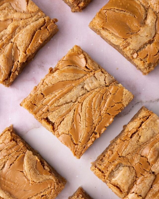 These easy one-bowl Biscoff Blondies takes classic blondies and swirls in a generous amount of cookie butter for that classic Biscoff taste in every single bite.

-½ cup unsalted butter, softened (1 stick)
-1 cup dark brown sugar (light works, too)
-1 large egg
-2 teaspoons vanilla extract
-1 cup all-purpose flour
-½ teaspoon baking powder
-½ teaspoon salt
-⅓ cup Biscoff cookie butter

-Preheat the oven to 350°F and line an 8×8 or 9×9-inch baking dish with parchment paper.
In a large mixing bowl, cream the butter and sugar together with the hand mixer on high, beating until well-combined and aerated.
-Add the egg and vanilla extract and mix again until just combined.
-Add the flour, baking powder, and salt and mix one last time to combine. Use a rubber spatula to scrape any dry ingredients stuck to the sides of the bowl to make sure everything is well-integrated.
-Transfer the blondie batter into the prepped pan. Pour the cookie butter on top of the batter in a squiggled line. If the cookie butter is too thick to work with, you can heat it up in the microwave for 10-25 seconds on high to loosen it.
-Use a knife to swirl the cookie butter into the blondie batter. Bake on the top rack for 20-25 minutes. Allow to cool before slicing into 9 or 12 pieces. Enjoy!