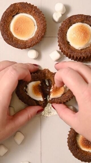 Take the classic combo of graham cracker, chocolate, and marshmallow to the next level with these S’mores Cookie Cups! A buttery graham cracker cookie cup base with crisp edges, stuffed with melted chocolate and topped with a toasted marshmallow.

-½ cup unsalted butter, softened
-¾ cup light brown sugar
-2 teaspoons vanilla extract
-1 large egg
-½ cup all-purpose flour
-¾ cup graham cracker crumbs (about 4 ground up graham crackers)
-½ teaspoon baking soda
-¼ teaspoon salt
-1.45 ounces dark or milk chocolate bar (1 standard bar)
-4 large marshmallows

Method 
-Preheat the oven to 375°F, and line or grease a muffin tin. If you are making the graham cracker crumbs yourself, do that now, too. Use a blender or food processor to grind the graham crackers into a fine dust.
-In a large mixing bowl, cream the butter and sugar together with a hand mixer (preferred) or whisk until well-combined (this may take up to 5 minutes!).
-Add the egg and vanilla extract and whisk to combine.
-Add the all-purpose flour, graham cracker crumbs, baking soda, and salt and combine. You’ll be left with a sticky wet dough.
-Use a large cookie scoop (or grab 2 heaping tablespoons of dough) to fill 8 muffin cups with dough.
-Bake on the top rack at 375°F for 14 minutes. They should be underbaked in the center.
-Place on cooling rack and allow to cool for 15 minutes. The center should sink, forming your cookie cups.
-Bring your oven temperature up to 400°F. Chop your chocolate and add about a heaping teaspoon of chopped chocolate to the center of each cookie cup.
-Cut your marshmallows in half and place one half of a marshmallow on top of the chocolate. -Place back into the oven for an additional 3-5 minutes until the marshmallows are golden brown. Allow to cool again for at least 10 minutes and enjoy!

#smores #summerdessert #toastedmarshmallow #choclate