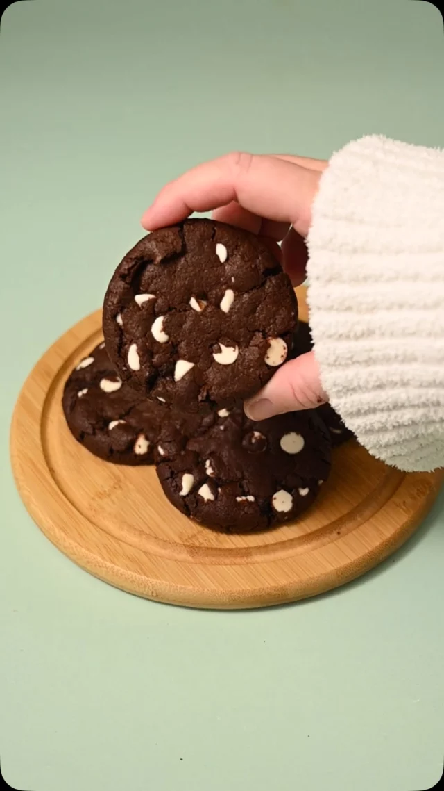 These Chocolate Cookies with White Chocolate Chips boast a delightful blend of rich cocoa flavor and creamy sweetness in every bite.

Chocolate Cookies with White Chocolate Chips 
-½ cup softened unsalted butter (1 stick)
-1 cup granulated sugar
-1 teaspoon vanilla extract
-1 large egg
-¾ cup all-purpose flour
-½ cup dark unsweetened cocoa powder
-¼ teaspoon salt (plus optional extra flaky sea salt for garnish)
-½ teaspoon baking soda
-1 cup white chocolate chips

-Preheat your oven to 350°F and line two large baking sheets with parchment paper or a reusable baking mat.
-To a large mixing bowl, add softened butter and sugar. Use a hand mixer on high to cream together until light and smooth (about 2-3 minutes).
-Add the egg and vanilla extract and use your hand mixer on low to combine.
-Add the flour, cocoa powder, salt, and baking soda and mix to combine, careful not to overbeat. Use a spatula to scrape any flour off the sides of the bowl and integrate it into your dough.
-Set aside a handful of white chocolate chips to add on top of the dough once the cookies are formed. Add the rest to your dough and use a rubber spatula to fold to combine.
-Use wet hands or a cookie scoop to shape 2 heaping tablespoons of dough into a ball and place it on your lined baking sheet. Leave a couple of inches in between each cookie for the dough to spread. Press a couple of white chocolate chips into the top of each cookie.
-Bake for 12-14 minutes until the edges are crispy to touch. Option to add extra flaky sea salt on top.