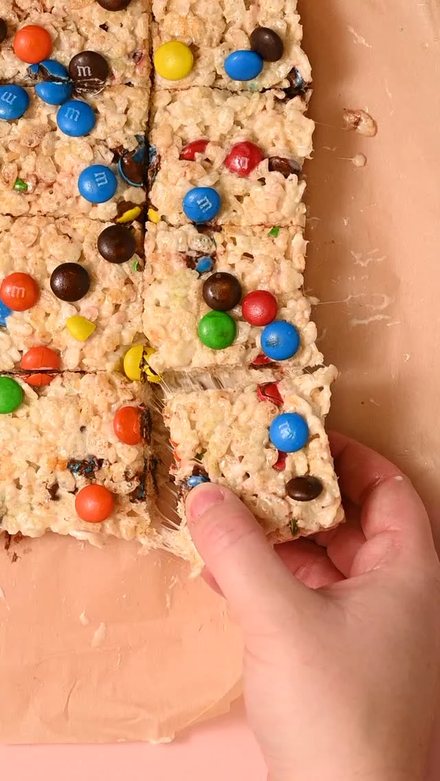 These M&M Rice Krispie Treats are the most colorful, fun, and sticky-sweet way to treat yourself, without ever turning on the oven!

4-Ingredient M&M Rice Krispie Treats
-5 tablespoons unsalted butter
-8 cups mini marshmallows
-6 cups Rice Krispies
-1 cup classic M & M’s

-Line a baking dish with parchment paper. Use a 9-inch x 13-inch for 1-inch-thick treats, or you can use a 9×9 or 8×8-inch square baking dish for thicker treats.
-To a large pot over low heat, add the butter and melt until liquefied.
-Still over low heat, add the marshmallows and stir frequently until melted. Make sure to scrape the bottom of the pot as you stir to ensure nothing sticks to the pot and burns.
-Remove the pot from heat and fold in the Rice Krispies, careful not to crush the cereal.
Stir in about ⅔ of the M&M's. Don't stir it too much, the color on the outside of the M&M's will bleed into the cereal.
-Transfer the mixture to your prepared pan and use wet hands to lightly press, spreading it into an even layer. Add the remaining M&M's on top and press those lightly into the top.
-Allow them to set at room temperature for about an hour, or in the refrigerator for 45 minutes before removing from the tray and cutting into 2-inch x 2-inch squares.

Comment "inbox" to have recipe sent directly to your DM's https://marleysmenu.com/colorful-mm-rice-krispie-treats/